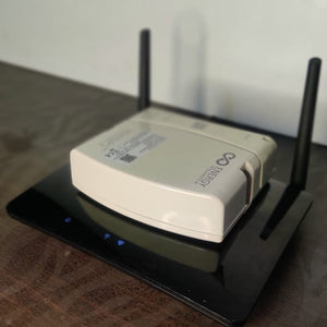 WiFi Router UPS on top of TPLink router to compare size