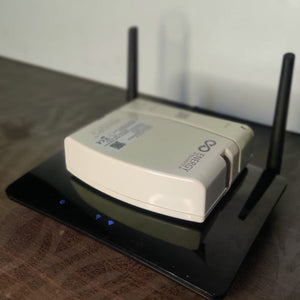 Energy Intelligence router UPS on top of  tp-link router to compare size