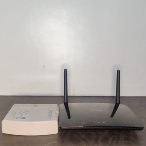 Energy Intelligence router UPS next to  a TP-Link Wifi Router